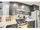 Modern kitchen with granite countertops and stainless steel appliances at 9023 N 3Rd Ave, Phoenix, AZ 85021