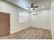 Bright living room with wood-look floors and ceiling fan at 9023 N 3Rd Ave, Phoenix, AZ 85021