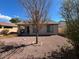 Charming backyard with gravel and a small tree at 3030 S 102Nd Ln, Tolleson, AZ 85353