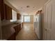 Eat-in kitchen with wood cabinets and tile flooring at 3030 S 102Nd Ln, Tolleson, AZ 85353