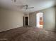 Large main bedroom with ceiling fan and en-suite bathroom at 3030 S 102Nd Ln, Tolleson, AZ 85353