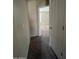 Simple hallway with carpet and doors to other rooms at 3030 S 102Nd Ln, Tolleson, AZ 85353