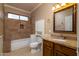 Clean bathroom, featuring a shower/tub combo, granite vanity, and updated fixtures at 851 N Pineview Dr, Chandler, AZ 85226