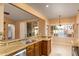 Modern kitchen with granite countertops, stainless steel appliances, and wood cabinets at 851 N Pineview Dr, Chandler, AZ 85226