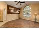 Spacious living room with a stone accent wall, vaulted ceilings, and tiled floors at 851 N Pineview Dr, Chandler, AZ 85226