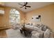 Bright living room with vaulted ceiling, large window, and comfy seating at 851 N Pineview Dr, Chandler, AZ 85226
