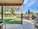 Covered patio with grassy area, seating, and a grill at 916 E Beautiful Ln, Phoenix, AZ 85042