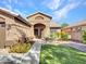 Single-story house with a two-car garage and a nicely landscaped yard at 916 E Beautiful Ln, Phoenix, AZ 85042