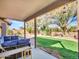 Covered patio with sectional sofa overlooking the backyard at 916 E Beautiful Ln, Phoenix, AZ 85042