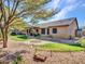 Landscaped backyard with pathway and covered patio at 916 E Beautiful Ln, Phoenix, AZ 85042