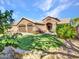 Well maintained front yard and landscaped grounds with a two car garage at 916 E Beautiful Ln, Phoenix, AZ 85042