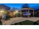 Backyard with hot tub, pergola, and patio umbrella at 5526 S Grenoble St, Mesa, AZ 85212