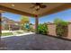 Covered patio with pergola, artificial turf, and lush landscaping at 5526 S Grenoble St, Mesa, AZ 85212