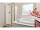 Spa-like bathroom with soaking tub, separate shower, and updated vanity at 5526 S Grenoble St, Mesa, AZ 85212