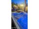 Relaxing hot tub with water feature and ambient lighting at 5526 S Grenoble St, Mesa, AZ 85212
