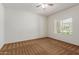 Bright bedroom with ceiling fan and window coverings at 5526 S Grenoble St, Mesa, AZ 85212