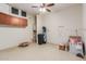 Garage with utility sink, water heater, and additional shelving at 5526 S Grenoble St, Mesa, AZ 85212