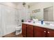 Clean bathroom with a bathtub, shower, and double vanity at 5526 S Grenoble St, Mesa, AZ 85212