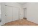 Spacious bedroom with double door closet and access to hallway at 5526 S Grenoble St, Mesa, AZ 85212