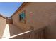 Side yard with a gate and a small patio area at 5526 S Grenoble St, Mesa, AZ 85212