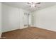 Bright bedroom with neutral carpeting and double doors at 5526 S Grenoble St, Mesa, AZ 85212