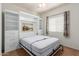 Bright bedroom with built-in wall bed and shelving at 5526 S Grenoble St, Mesa, AZ 85212