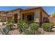 Single-story home with desert landscaping and a two-car garage at 5526 S Grenoble St, Mesa, AZ 85212