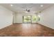 Living room with tile floors, sliding glass doors, and ceiling fan at 5526 S Grenoble St, Mesa, AZ 85212