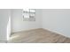 Well-lit bedroom featuring tile flooring and a window at 1356 E Cherrywood Pl, Chandler, AZ 85249