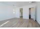 Bright bedroom with wood-look tile flooring and access to bathroom at 1356 E Cherrywood Pl, Chandler, AZ 85249