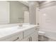 Clean bathroom with white vanity, bathtub, and shower at 43958 W Stonecreek Rd, Maricopa, AZ 85139