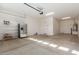 Spacious garage with extra shelving and room for storage at 43958 W Stonecreek Rd, Maricopa, AZ 85139