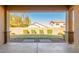 Landscaped backyard with grassy lawn and covered patio at 43958 W Stonecreek Rd, Maricopa, AZ 85139