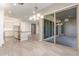 Bright kitchen featuring tile floors and sliding glass doors at 43958 W Stonecreek Rd, Maricopa, AZ 85139