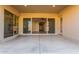 Covered patio with glass doors leading to the interior at 43958 W Stonecreek Rd, Maricopa, AZ 85139
