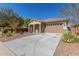One-story house with a two-car garage and well-maintained landscaping at 43958 W Stonecreek Rd, Maricopa, AZ 85139