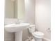 Clean bathroom with pedestal sink and neutral color scheme at 43958 W Stonecreek Rd, Maricopa, AZ 85139