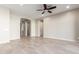Spacious living room featuring tile floors and neutral walls at 43958 W Stonecreek Rd, Maricopa, AZ 85139