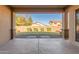 Landscaped backyard with grassy lawn and covered patio at 43958 W Stonecreek Rd, Maricopa, AZ 85139