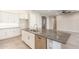 Kitchen island with granite countertop and stainless steel appliances at 43958 W Stonecreek Rd, Maricopa, AZ 85139