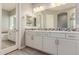 Elegant bathroom with double vanity, soaking tub, and separate shower at 43958 W Stonecreek Rd, Maricopa, AZ 85139