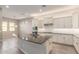 Modern kitchen with large island and granite countertops at 43958 W Stonecreek Rd, Maricopa, AZ 85139