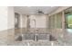Modern kitchen sink with granite countertops and stainless steel double basin at 43958 W Stonecreek Rd, Maricopa, AZ 85139