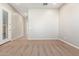 Spacious living room with neutral carpeting and an open floor plan at 43958 W Stonecreek Rd, Maricopa, AZ 85139
