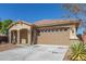 Single-story home with a large two-car garage and neutral exterior at 43958 W Stonecreek Rd, Maricopa, AZ 85139