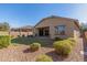 View of home's back elevation and landscaped yard at 43958 W Stonecreek Rd, Maricopa, AZ 85139