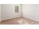 Bright bedroom with neutral walls and carpeted floor at 43958 W Stonecreek Rd, Maricopa, AZ 85139