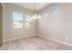 Spacious dining area with tile floors and light-filled windows at 43958 W Stonecreek Rd, Maricopa, AZ 85139