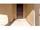 Dark brown front door adds a touch of elegance to the home's exterior at 43958 W Stonecreek Rd, Maricopa, AZ 85139