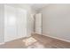 Well-lit bedroom with double door closet and carpet flooring at 43958 W Stonecreek Rd, Maricopa, AZ 85139